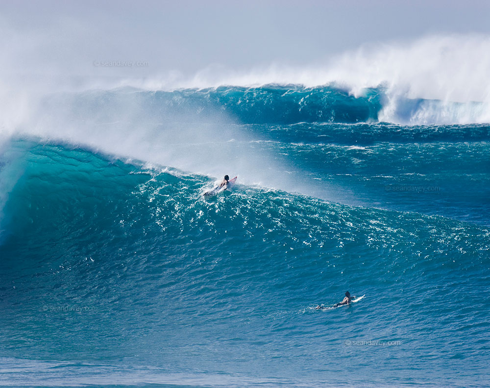 Big-wave surfer dropping in at Pipeline, North Shore of Oahu